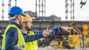 Two supervisors discuss instructions and provide guidance