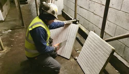 NVQ Level 2 fire stopper carrying out passive fire protection work