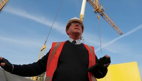 NVQ Level 7 senior manager overlooking site progress