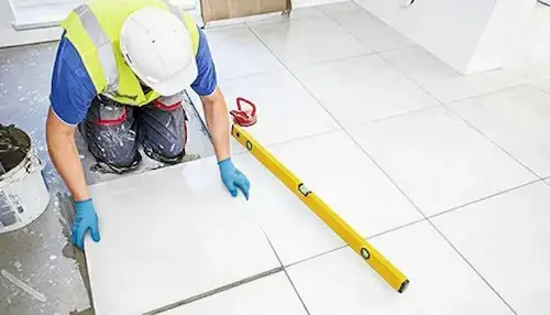 Wall and Floor Tiling NVQ Level 2 tiler laying tiles on site